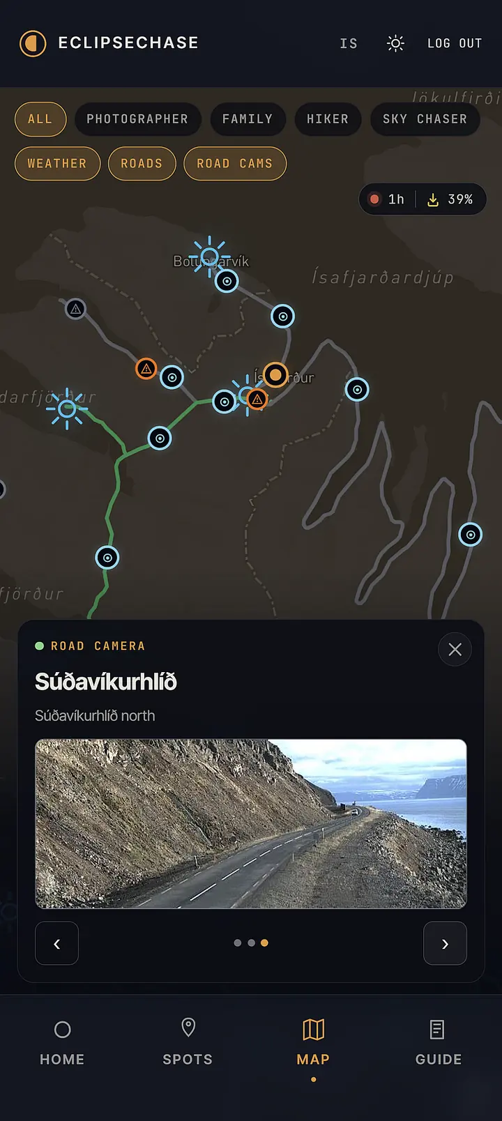 EclipseChase map showing Westfjords region with a live road camera image from Súðavíkurhlíð showing a coastal road with cliffs and fjord visible.